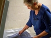 Staffer Barbara Dew at the freezer