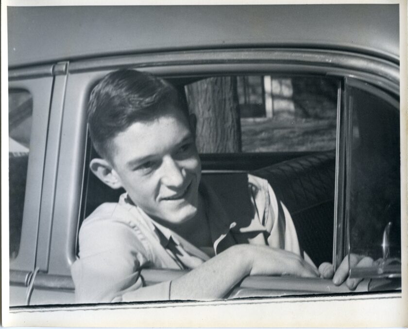 In this self-portrait, teenaged Jack Bremer leans out of an open car window.